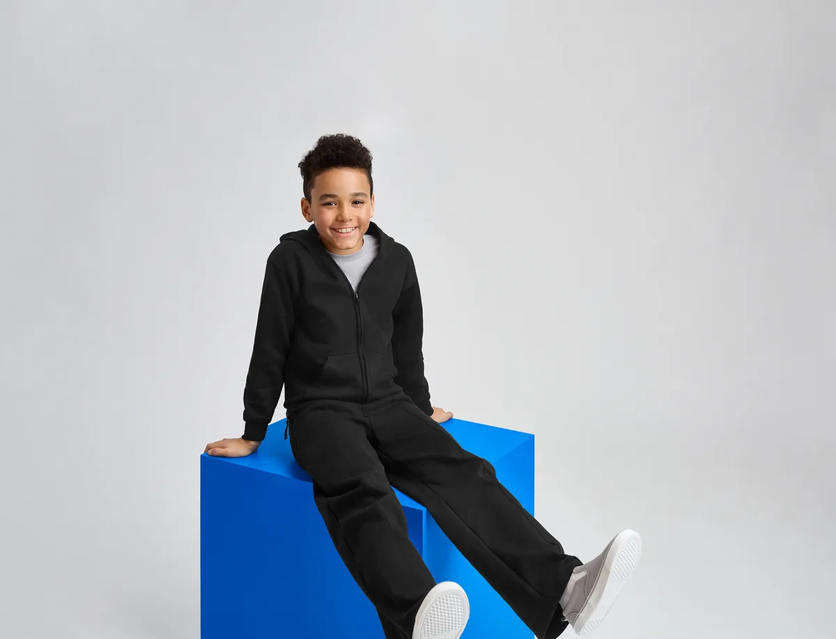 Gildan Youth Heavy Blend Full-Zip Hooded Sweatshirt — Style 18600B in Black — manufacturer lifestyle photo