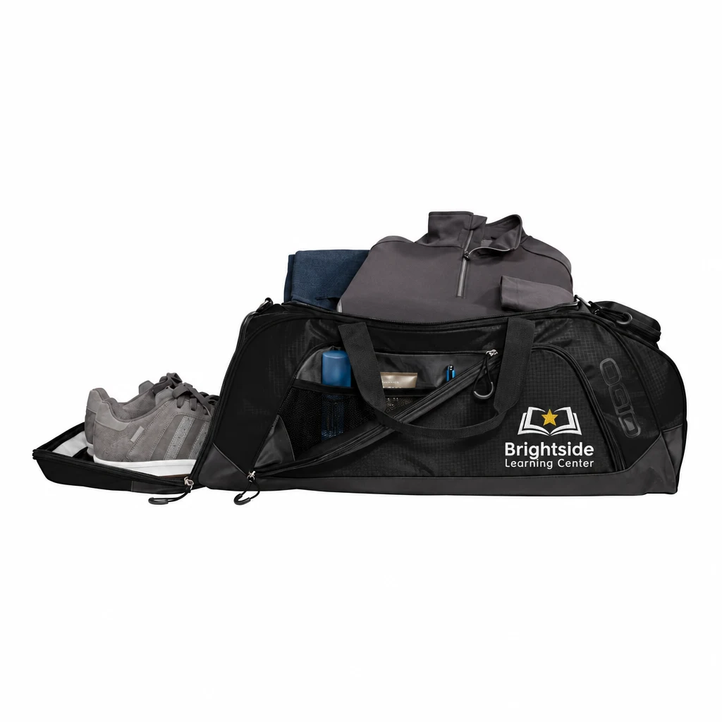 Custom OGIO Transition Duffel (411097) in Black/ Black, flat-lay view with a custom embroidered logo.