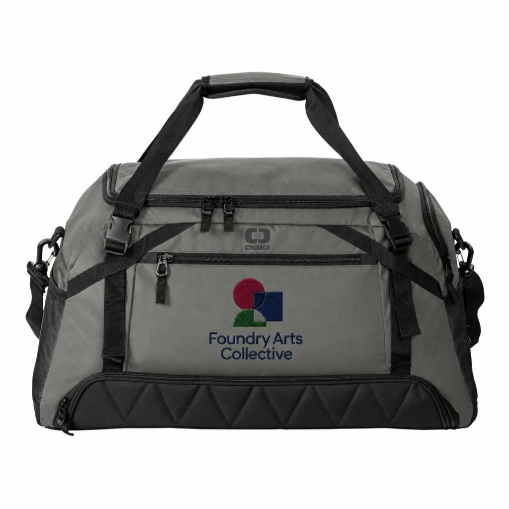 Custom OGIO Motion Duffel (411099) in Rogue Grey, flat-lay view with a custom embroidered logo.