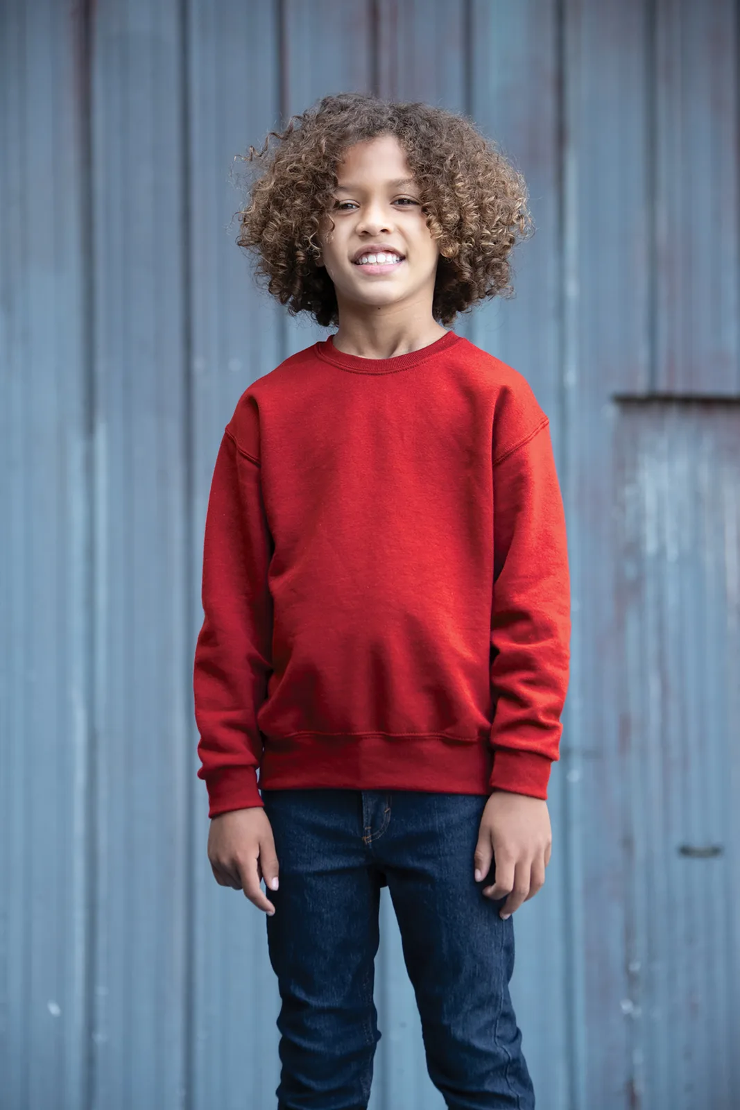Jerzees - Youth NuBlend Crewneck Sweatshirt — Style 562B in True Red — manufacturer lifestyle photo