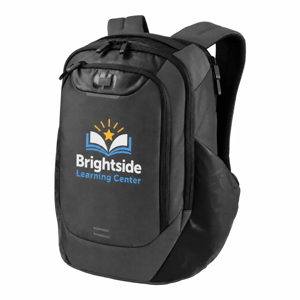 Custom OGIO Monolithic Pack (91004) in Tarmac, flat-lay view with a custom printed logo. Example design