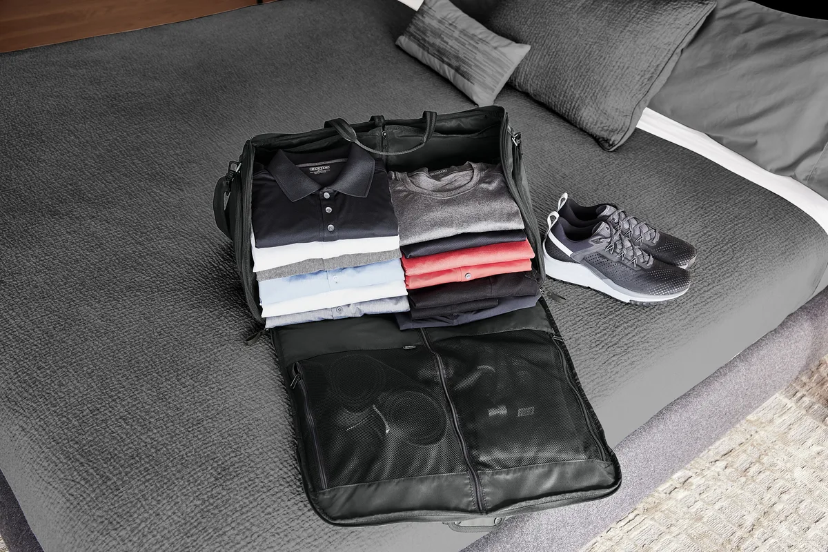 OGIO Transform Garment Duffel — lifestyle photo, shown in Blacktop