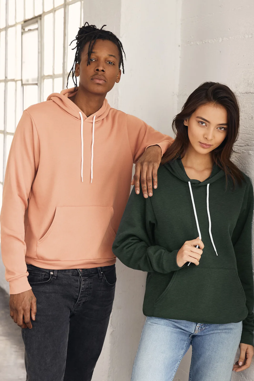 BELLA+CANVAS Unisex Sponge Fleece Pullover Hoodie — Style BC3719 in Peach — manufacturer lifestyle photo