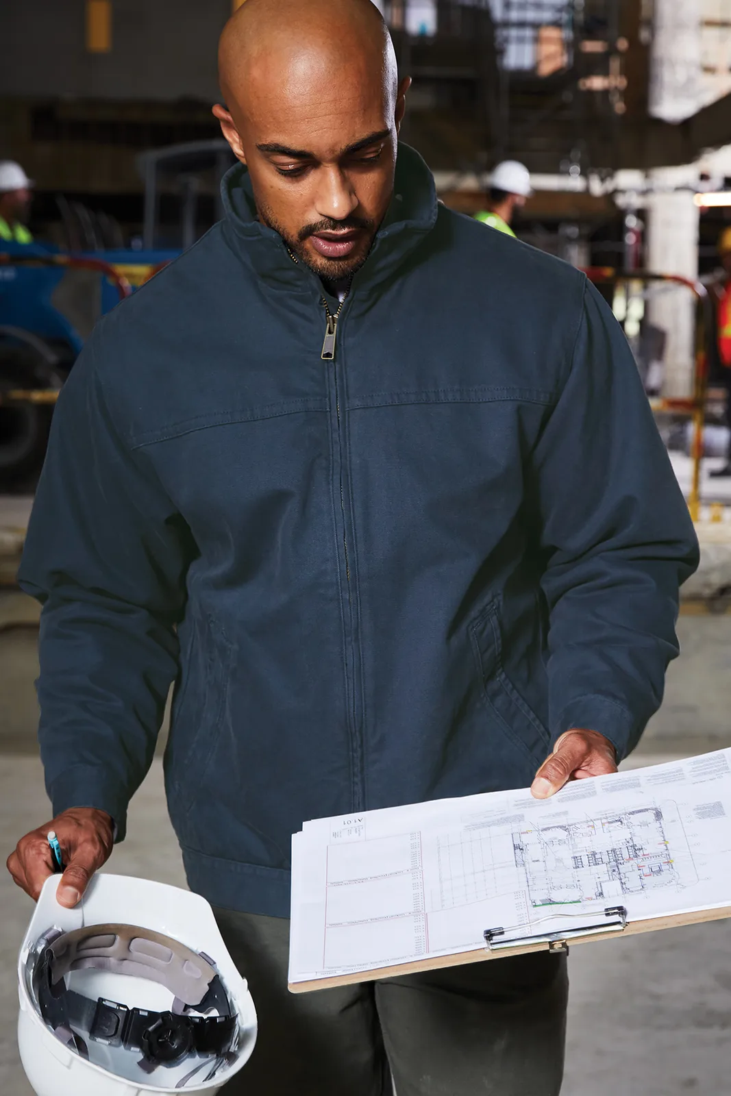 CornerStone Washed Duck Cloth Flannel-Lined Work Jacket — Style CSJ40 in Navy — manufacturer lifestyle photo