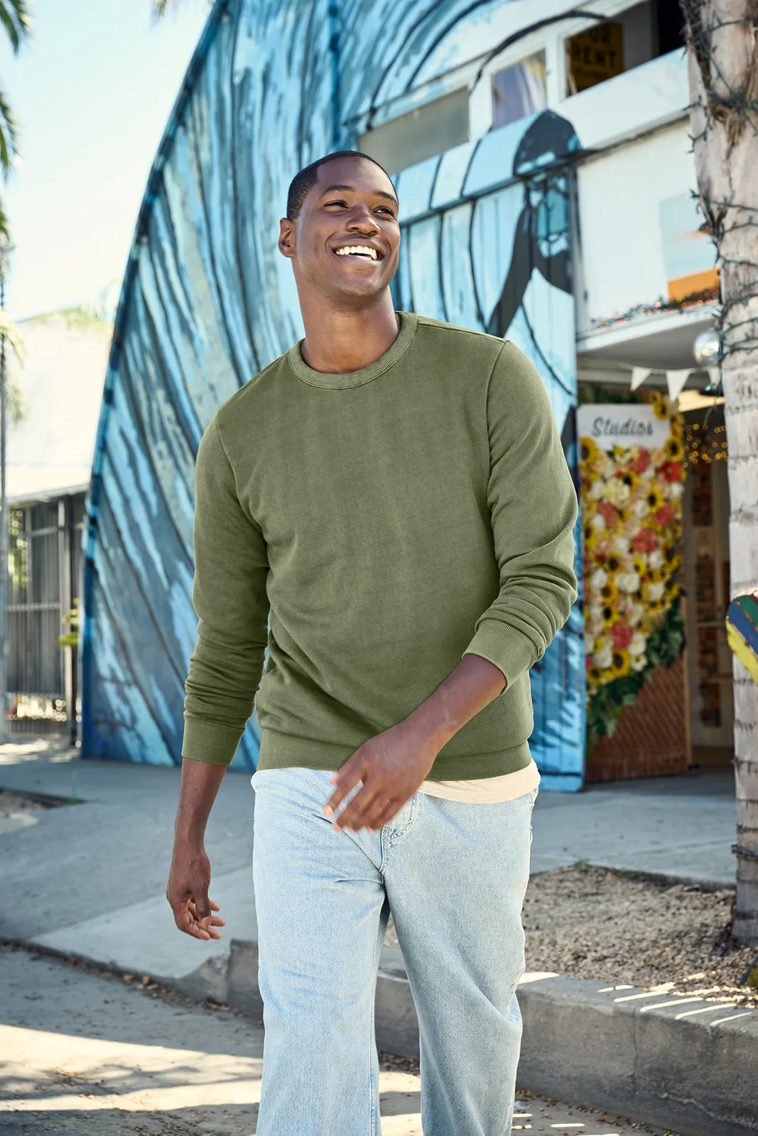 District Wash Fleece Crew — Style DT2204 in Olive Drab Green — manufacturer lifestyle photo
