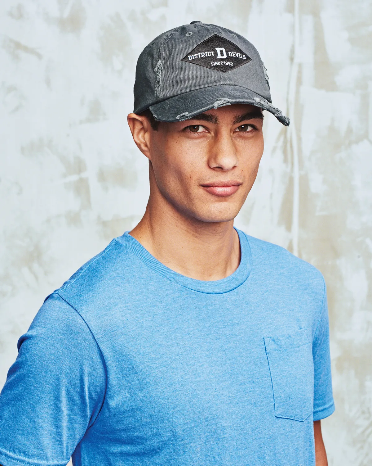 District Distressed Cap — Style DT600 in Black — manufacturer lifestyle photo