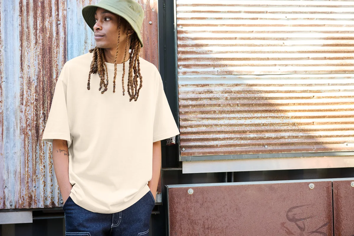 District Heavyweight Very Important Tee — Style DT6065 in Griege — manufacturer lifestyle photo
