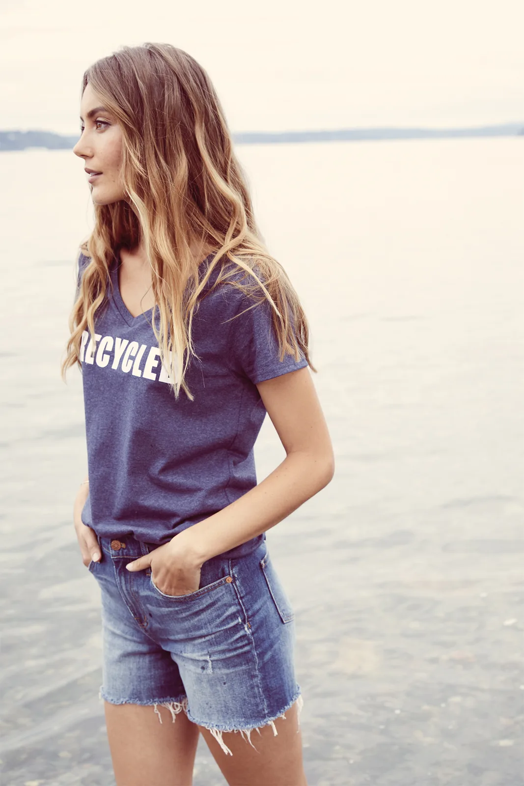 District Women's Re-Tee V-Neck — Style DT8001 in True Navy — manufacturer lifestyle photo