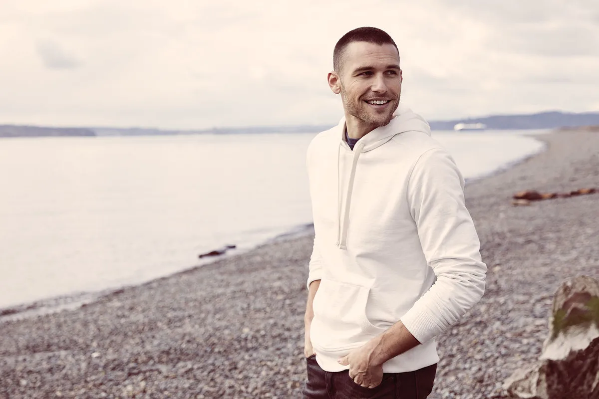 District Re-Fleece Hoodie — Style DT8100 in White — manufacturer lifestyle photo