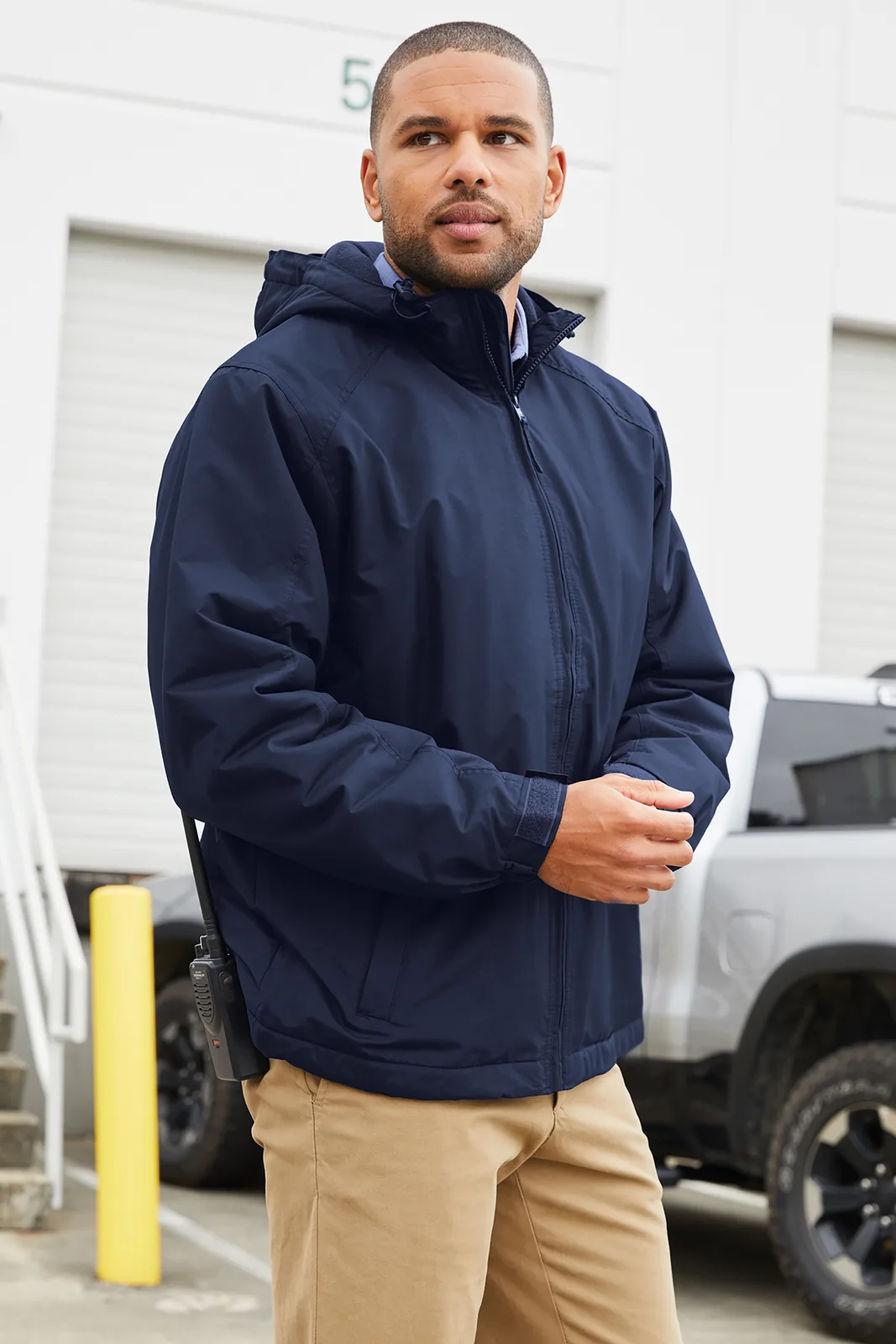 Port Authority Hooded Charger Jacket — Style J327 in True Navy — manufacturer lifestyle photo