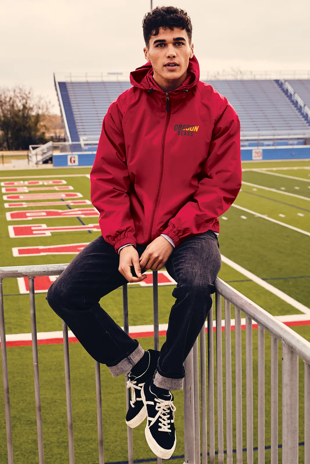 Sport-Tek Hooded Raglan Jacket — Style JST73 in True Red — manufacturer lifestyle photo