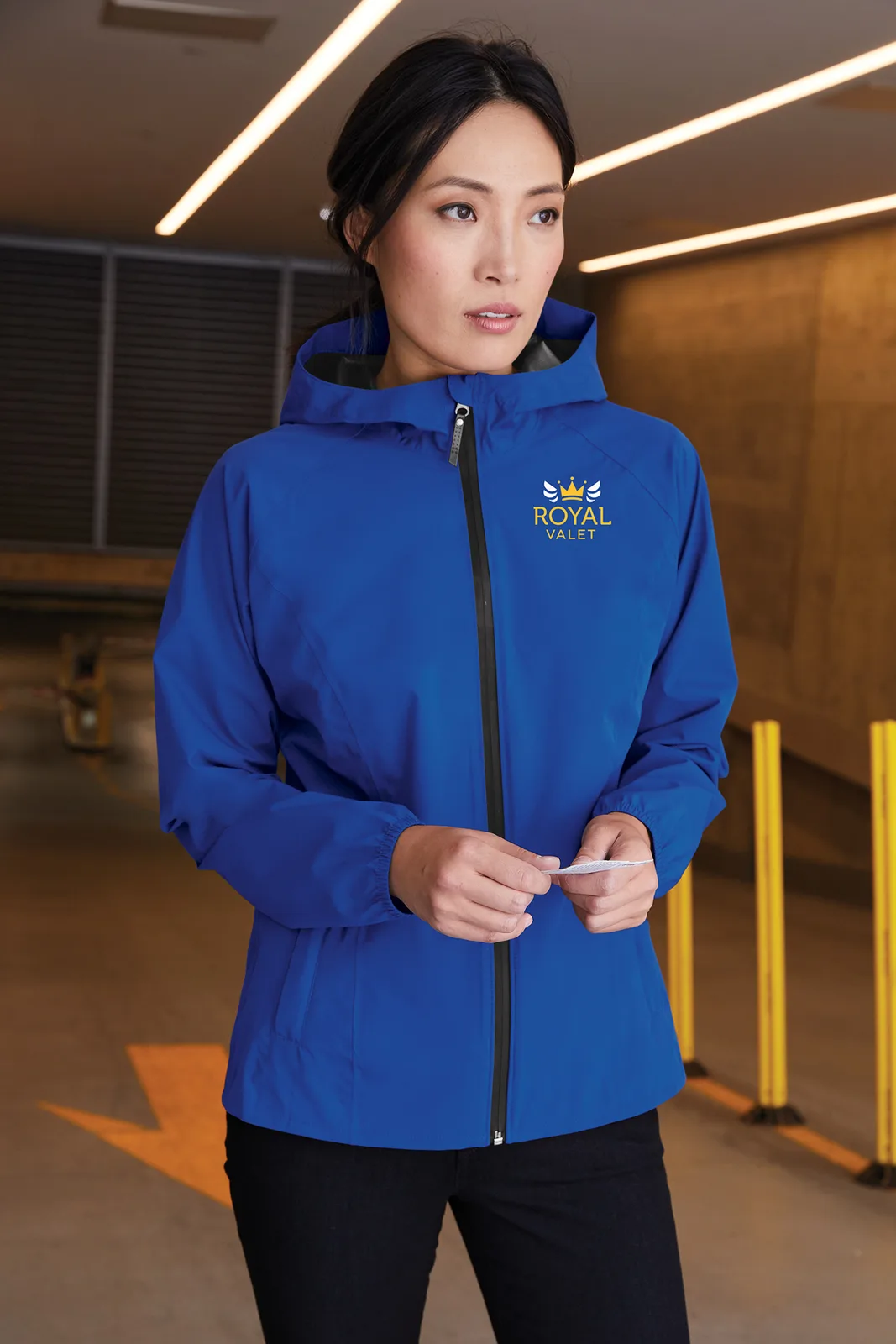 Port Authority Women's Essential Rain Jacket — Style L407 in True Royal — manufacturer lifestyle photo