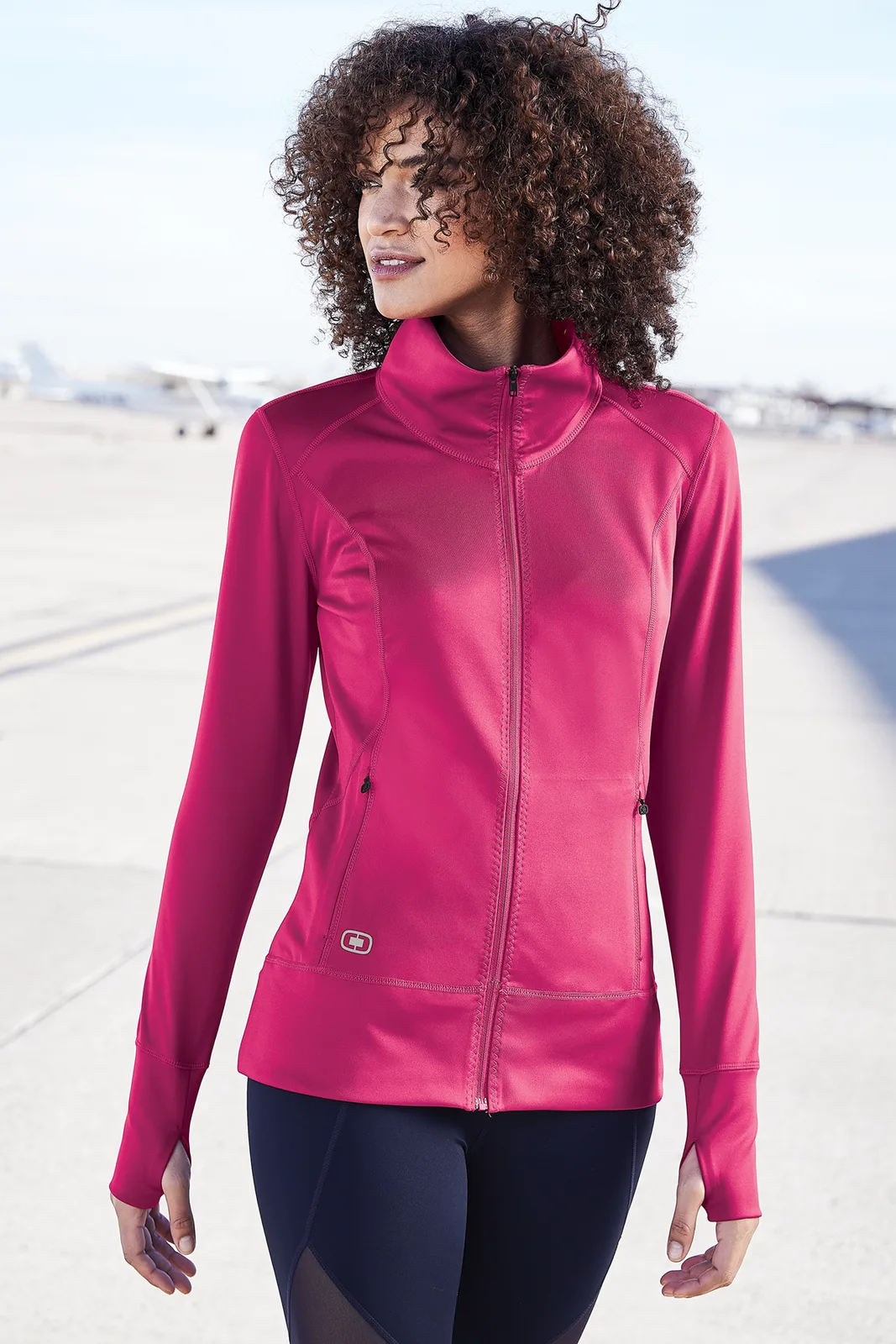 OGIO Women's Fulcrum Full-Zip — Style LOE700 in Flush Pink — manufacturer lifestyle photo