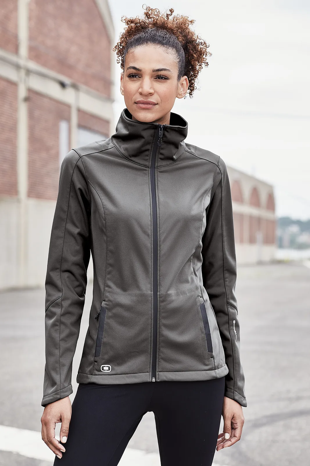 OGIO Women's Crux Soft Shell — Style LOE720 in Gear Grey — manufacturer lifestyle photo