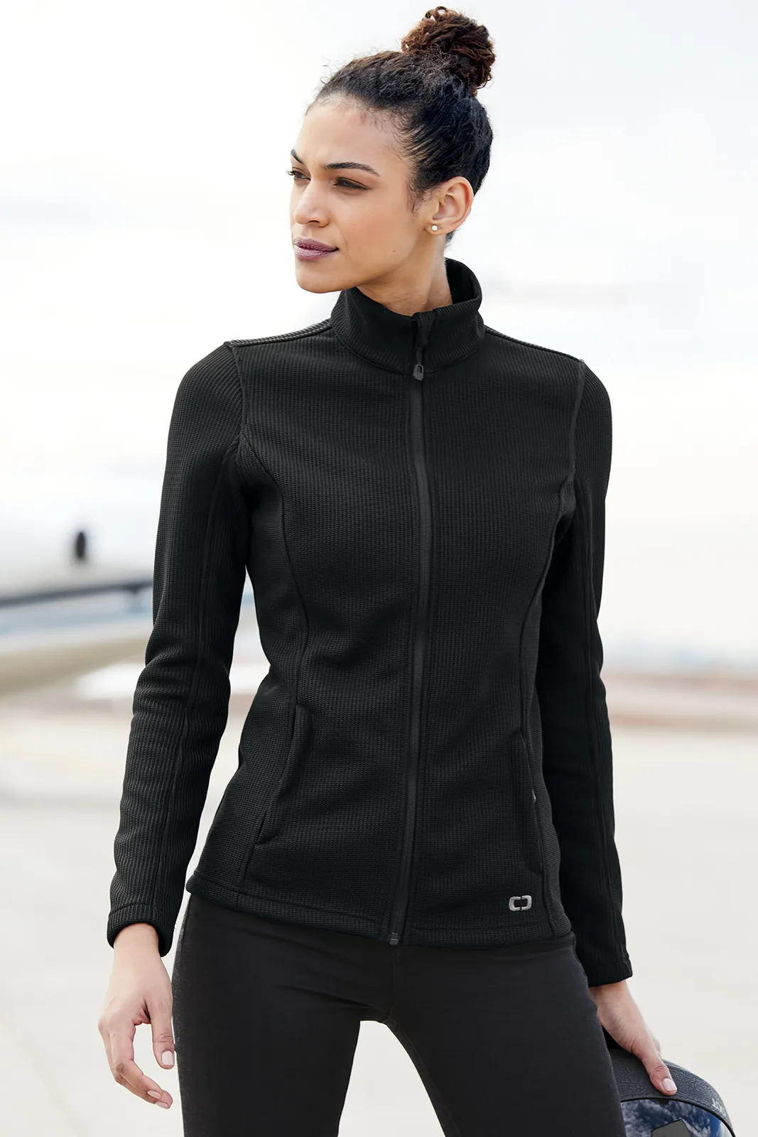OGIO Women's Grit Fleece Jacket — Style LOG727 in Blacktop — manufacturer lifestyle photo