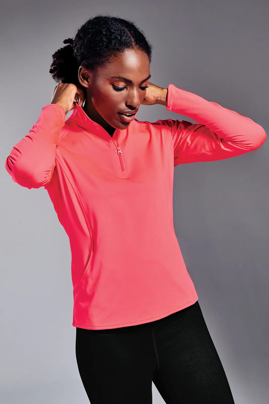 Sport-Tek Women's Sport-Wick Stretch 1/4-Zip Pullover — Style LST850 in Hot Coral — manufacturer lifestyle photo