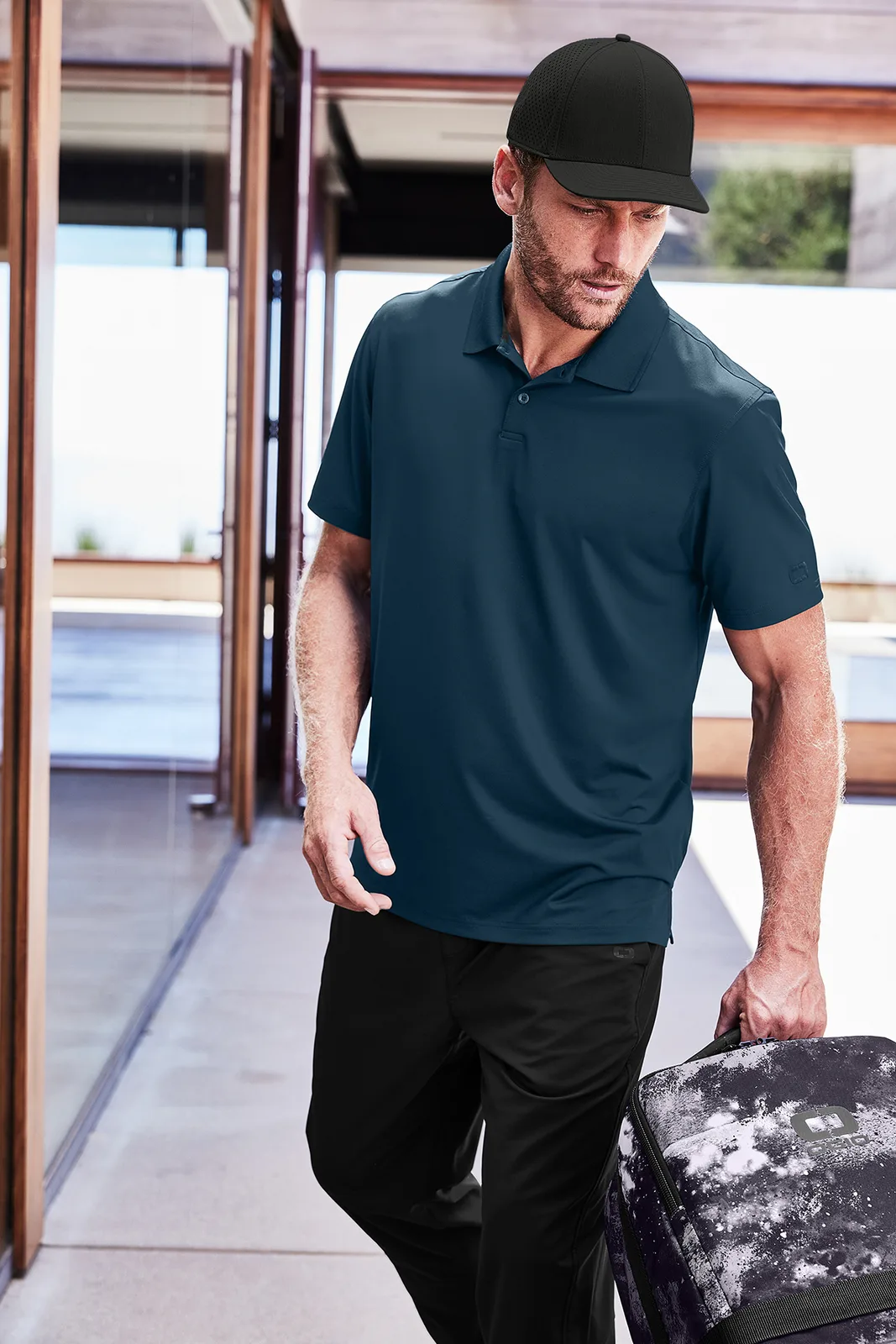 OGIO Regain Polo — Style OG170 in River Blue Navy — manufacturer lifestyle photo