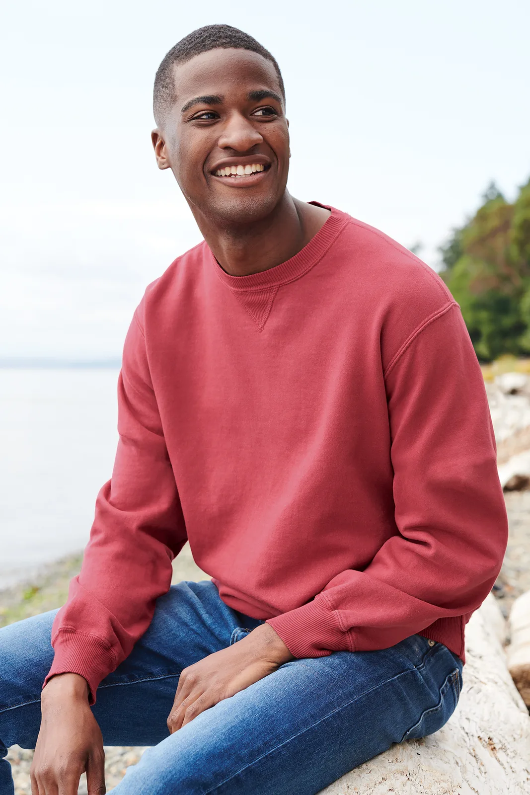 Port & Co Beach Wash Garment-Dyed Crewneck Sweatshirt — Style PC098 in Fruit Punch — manufacturer lifestyle photo