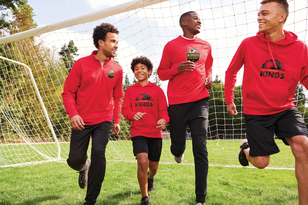 Port & Co Performance Fleece Pullover Hooded Sweatshirt — Style PC590H in Red — manufacturer lifestyle photo