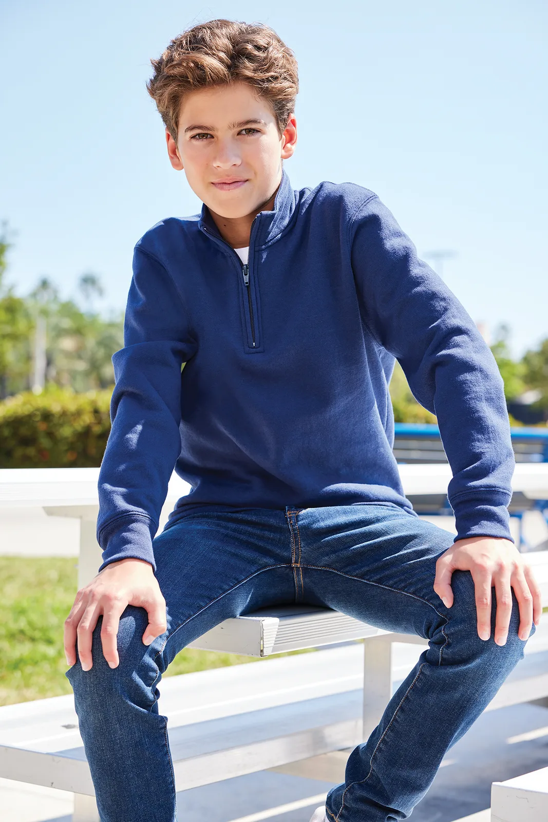 Port & Co Youth Core Fleece 1/4-Zip Pullover Sweatshirt — Style PC78YQ in Navy — manufacturer lifestyle photo