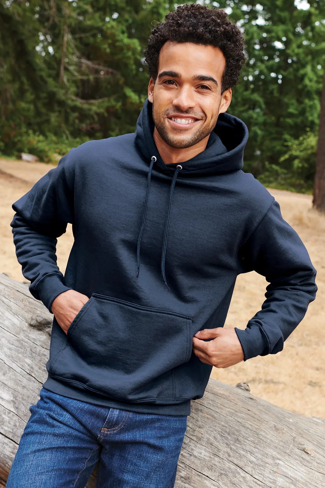 Port & Co Essential Fleece Pullover Hooded Sweatshirt — Style PC90H in Navy — manufacturer lifestyle photo
