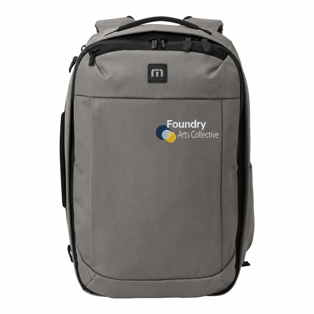 Custom TravisMathew Lateral Convertible Backpack (TMB106) in Graphite, flat-lay view with a custom embroidered logo.
