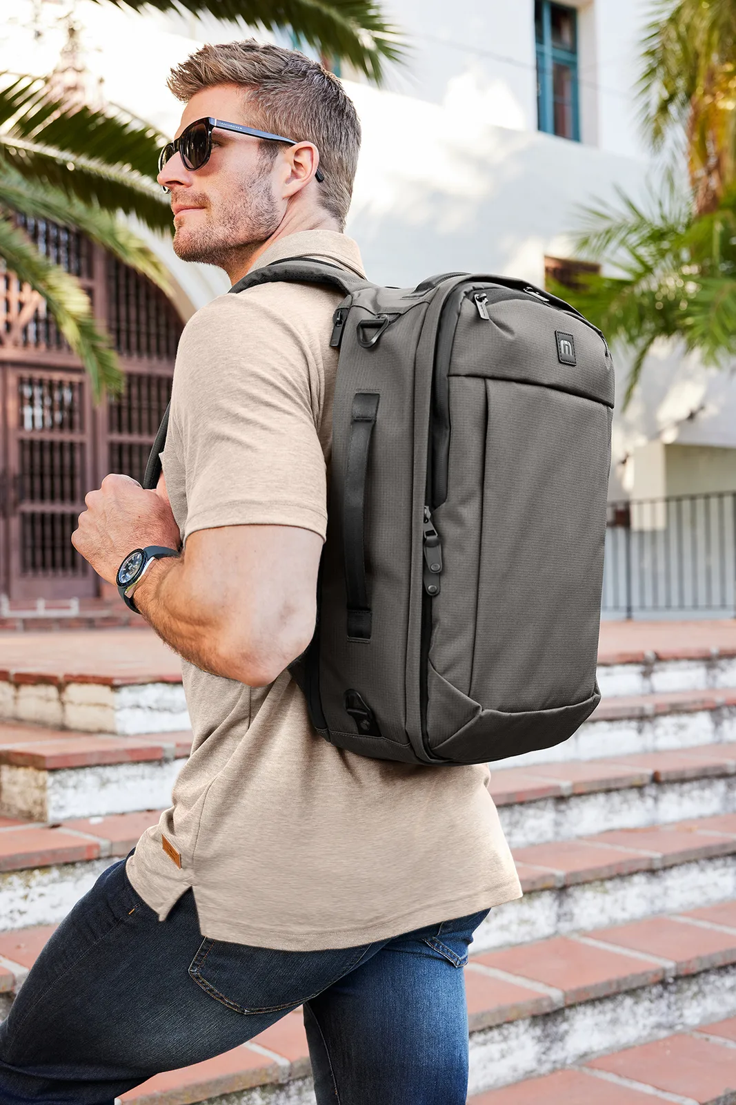 Custom TravisMathew Lateral Convertible Backpack — lifestyle photo