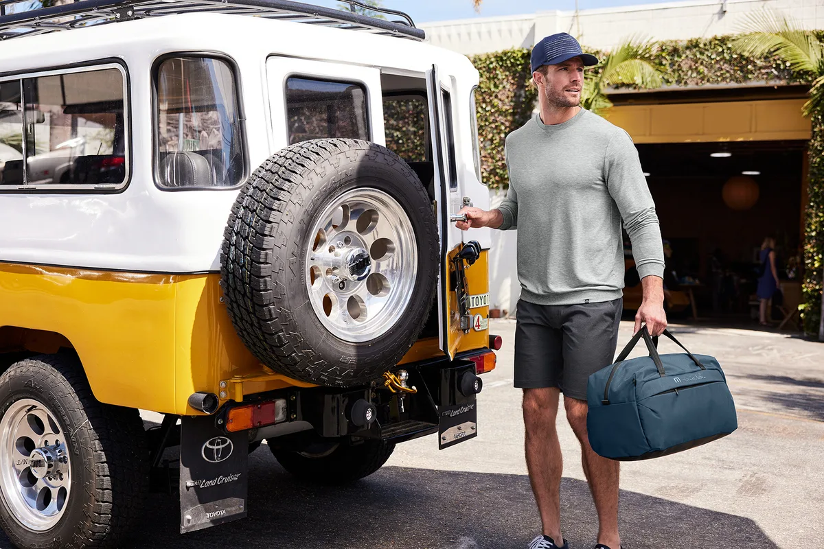 Custom TravisMathew Lateral Duffel — lifestyle photo
