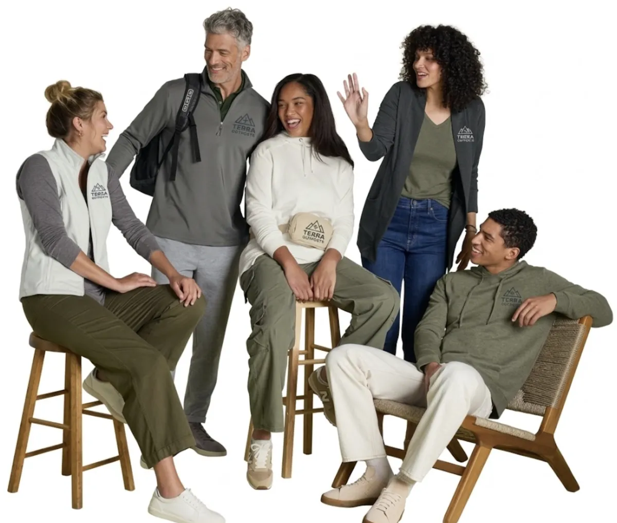 Five people in gray and olive company apparel with Terra Outfitters logos on a vest, quarter-zip, hoodie, cardigan and cap