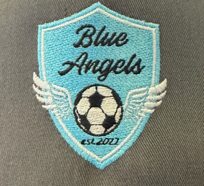 Turquoise soccer shield logo embroidered for a team