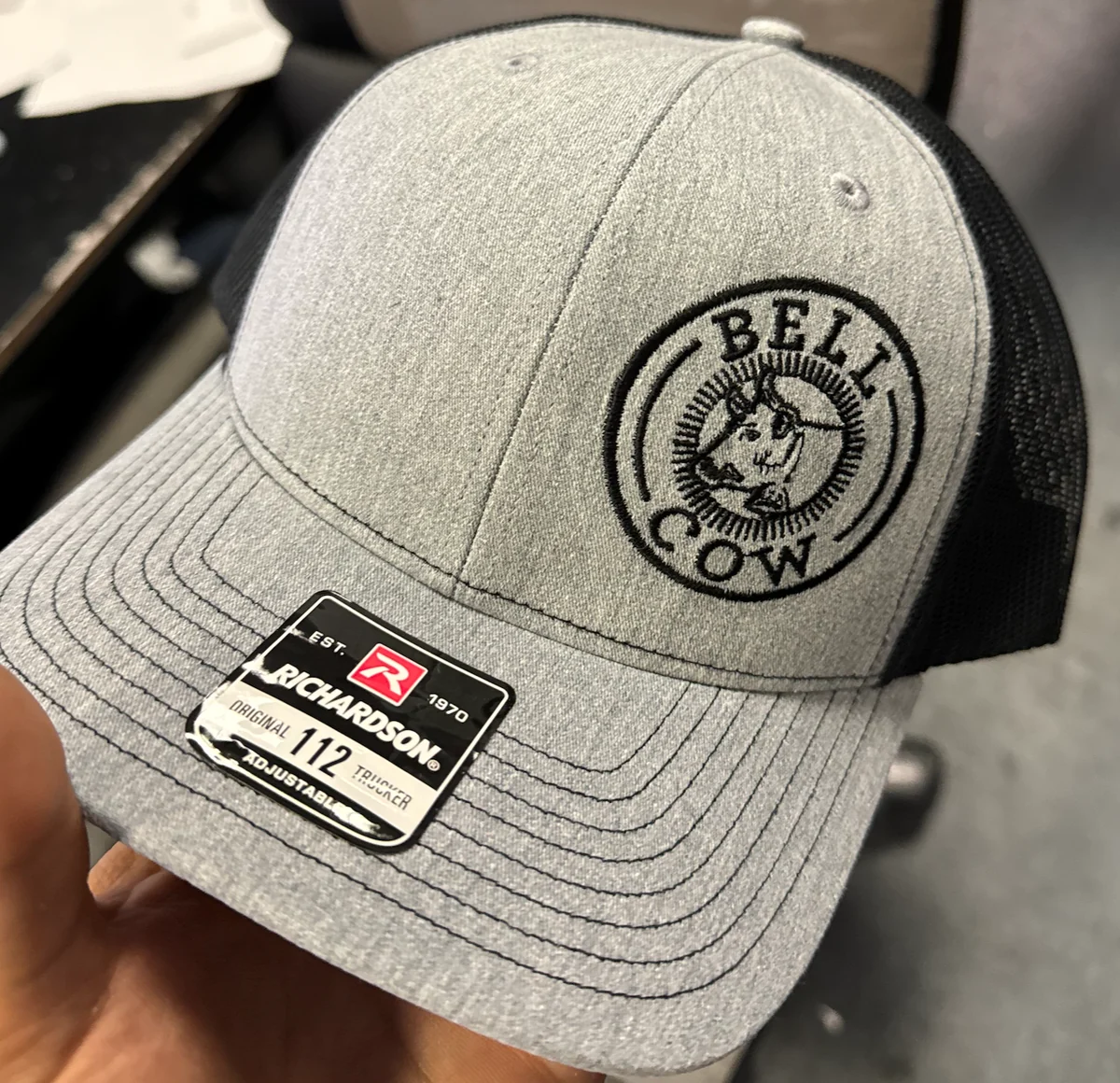 Gray cap with a black circular BELL CCW logo embroidered on the front
