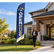 Custom feather flag with a real estate message displayed outside a property
