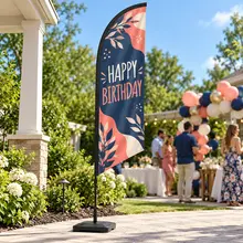 Small custom feather flag with a birthday message displayed outdoors