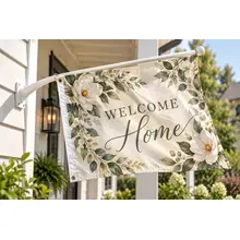 Custom home welcome flag attached to a porch pole