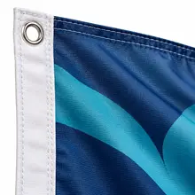 Close-up of the reinforced edge and metal grommet on a rectangular printed flag