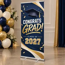 Custom retractable graduation banner displayed at a celebration