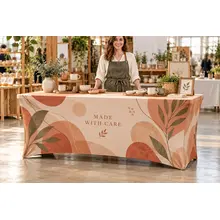 Six-foot custom stretch table cover at an artisan market booth