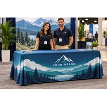 Custom full-color table throw at a business expo with staff behind the booth