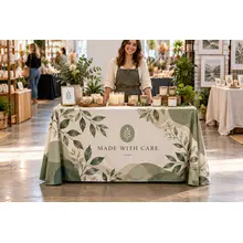 Four-foot custom table throw at a vendor market with a shopper nearby